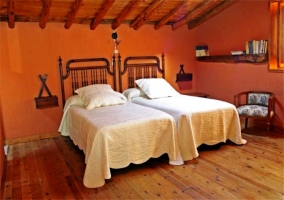  Kitchen with wooden ceiling. Chairs and table 