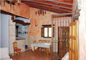  Dining room with table and chairs and rustic decoration 