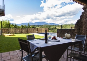  Dining table with pool in the background 