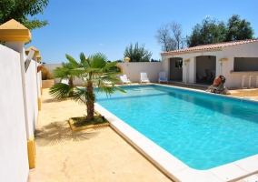  Swimming pool with sun loungers 