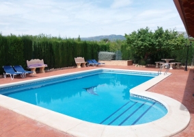  Swimming pool with sun loungers 