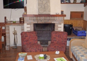  Living room with fireplace next to the plasma TV 