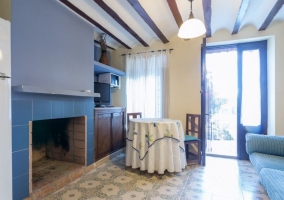  Living room and dining room with fireplace framed in brick 