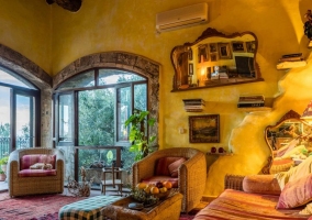  Living room with fireplace in the center of stone 