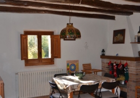  Living room with wooden table and stone walls 