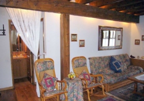  Living room and kitchen at the back with wooden furniture 