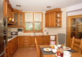  Kitchen dining room with wooden furniture 