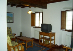  Living room with armchairs in front of the TV 