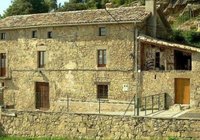 Access to the house with natural stone facade 