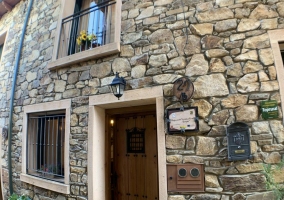 Access to the house with stone facade 