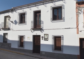 Access to the house with a white facade 