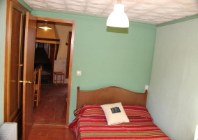  Double bedroom with striped bedspread 