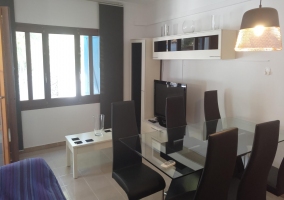  Dining room with glass table and black chairs 