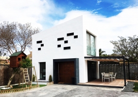  Large exterior of the house with porch and leisure areas 