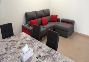  Living room with armchairs and red cushions 