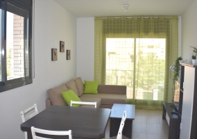  Living room with armchairs in the background and terrace 