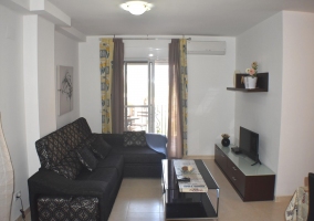  Living room with armchairs and glass table 