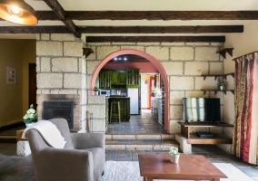  Living room with stone wall and plasma TV 