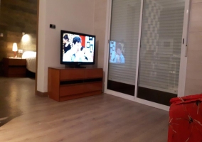  Living room next to the kitchen with plasma TV 