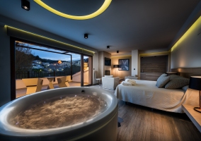  Spacious bedroom with its Jacuzzi at night 