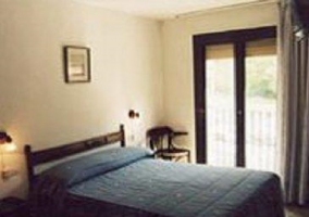 room with double bed and bay window 