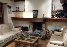  Large living room with fireplace and wooden table 